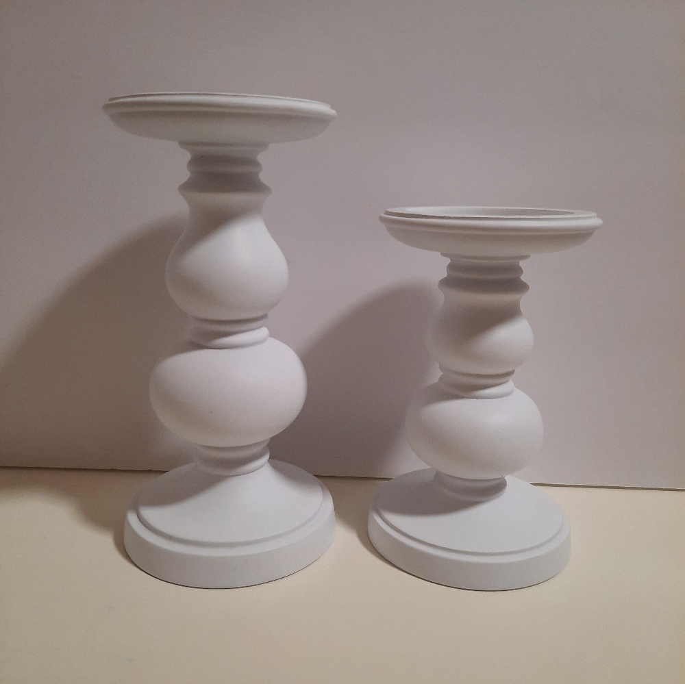 Elegant White Candle Holders And Candles.